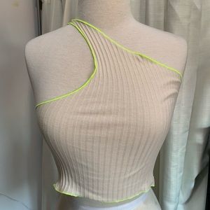 One shoulder cream crop top neon green lining.